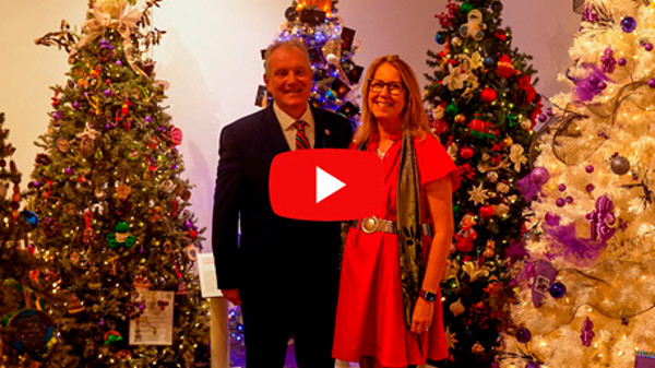 President Blake and his wife with christmas trees and Youtube play button